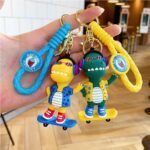 Llavero dinosaurio skate y guitarra correa de goma - Imagen 10