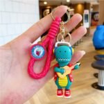 Llavero dinosaurio skate y guitarra correa de goma - Imagen 12