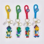 Llavero dinosaurio skate y guitarra correa de goma - Imagen 7